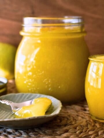 Lemon Curd in jar and on spoon.