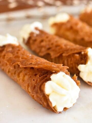 brandy snaps on plate.