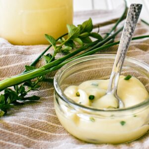 condensed milk mayo in dish with whole jar in background.