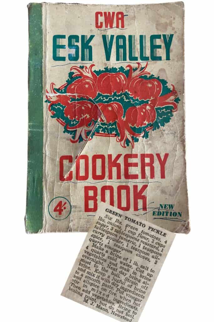 copy of cover and clipping from cookery book containing green tomato pickles recipe.