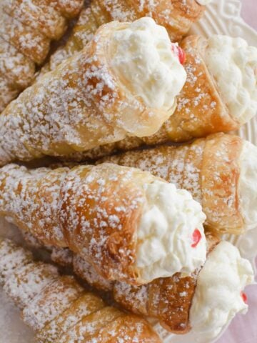 cream horns on plate.