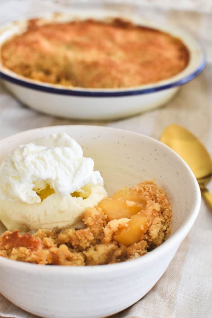 apple crumble served with ice cream.