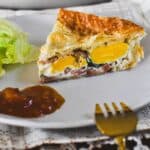 egg and bacon pie on plate.