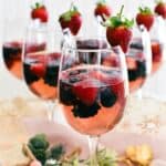 berries in moscato jelly served in wine glasses.