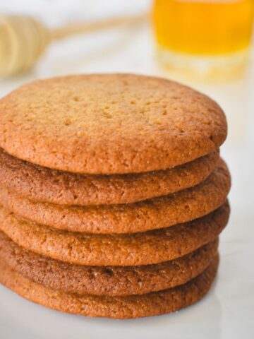 Honey Snaps Biscuits stacked on plate.