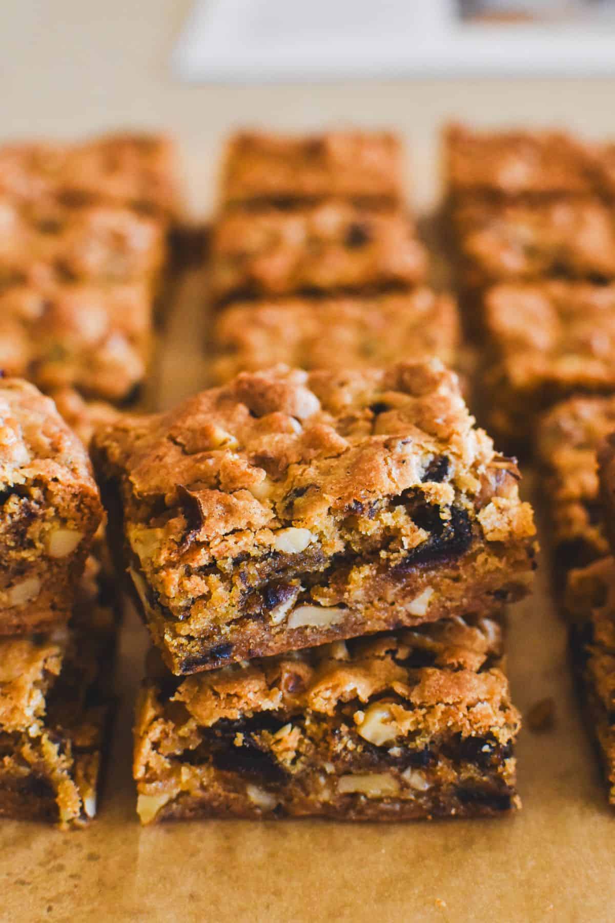 Close up of piece of of caramel date slice.