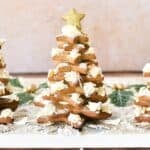 Golden star-shaped Christmas cookies decorated as a festive tree, perfect for holiday baking and dessert tables.