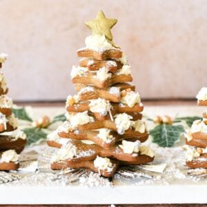 Golden star-shaped Christmas cookies decorated as a festive tree, perfect for holiday baking and dessert tables.